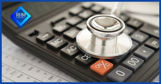 stethoscope on calculator